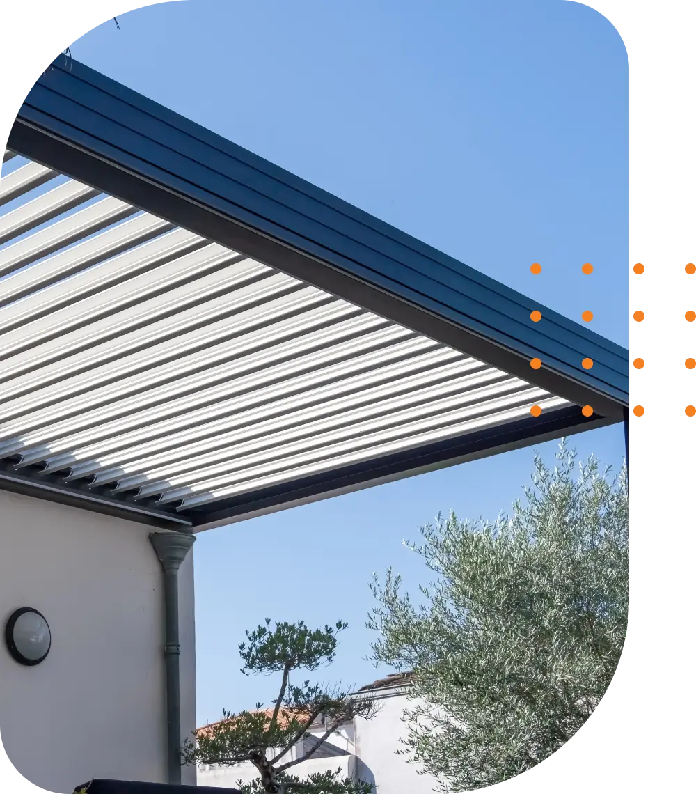 Louvered roof system with a clear, blue sky in the background.