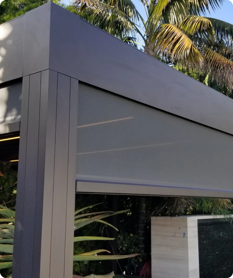 Roller privacy shades installed on an outdoor kitchen area in Austin, Texas.