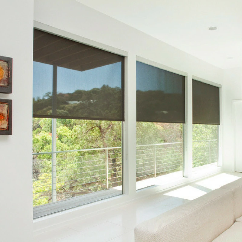 Black interior roll-up solar screens installed inside of a modern Austin home.