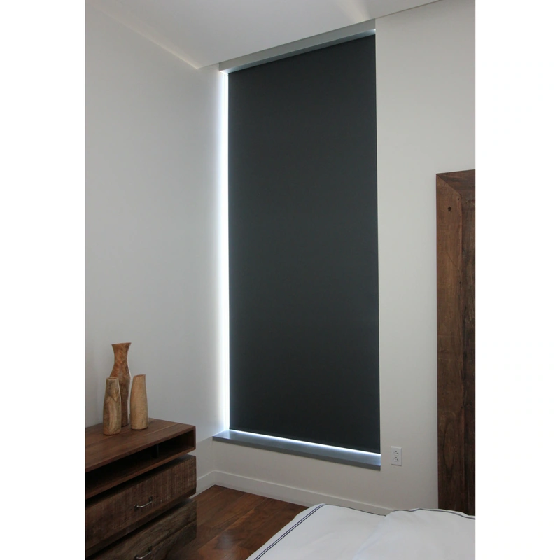 Black room darkening shades, custom designed to fit within a narrow window.
