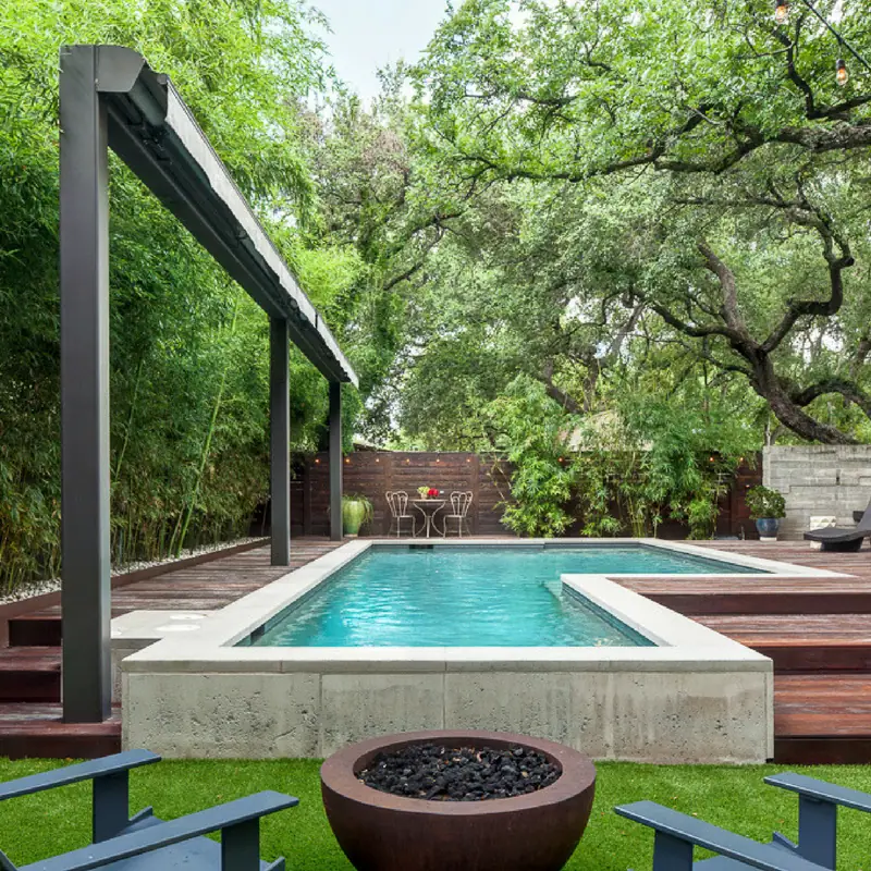 Custom exterior awning installed over a pool as a free-standing structure.