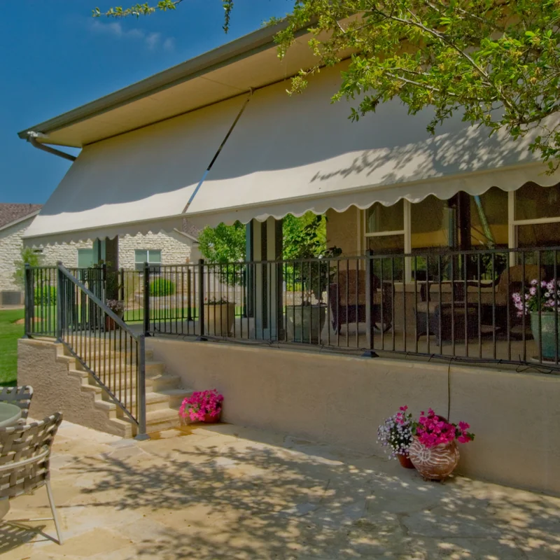 Cream-colored custom exterior awning designed and installed on an Austin home.