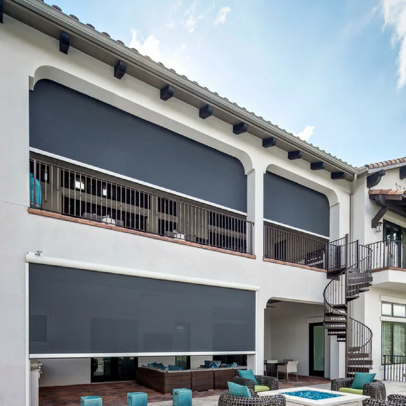 Two-story house with custom exterior roller shades, a Texas Sun & Shade product.