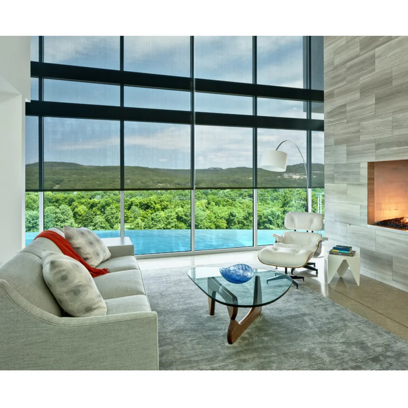 Large, modern living room with floor-to-ceiling windows and a custom roller shade system.
