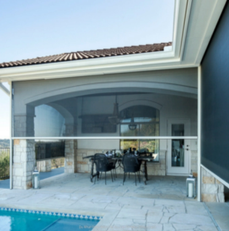 Retractable insect and privacy screen installed on the outdoor patio area of a home.