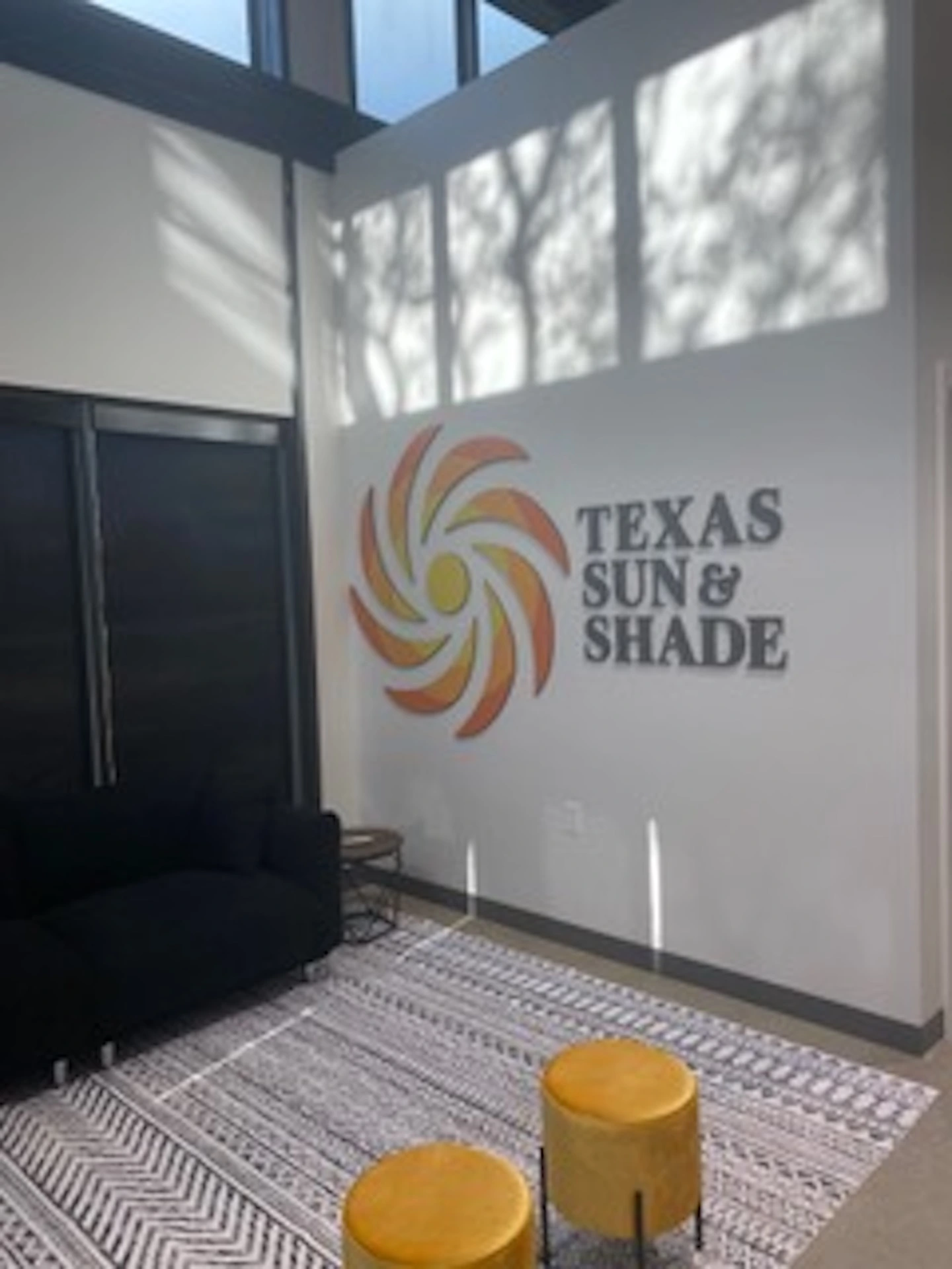Entrance to the Texas Sun & Shade showroom featuring the company logo.